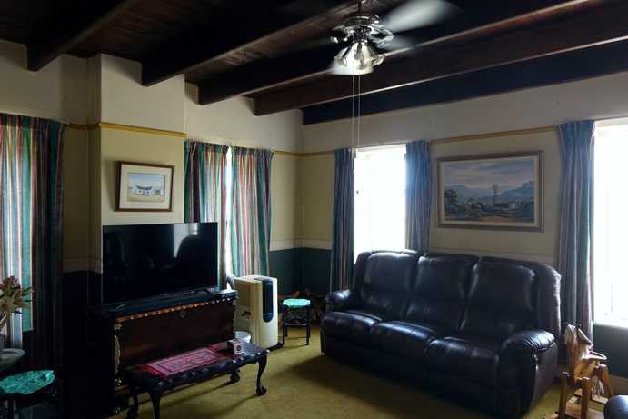 The living room of the old farmhouse on Zeekoevlei 109. Despite the exterior decay, the remaining architectural details and traces of furnishings hint at the warmth and pride once held by the Engelbrecht family.